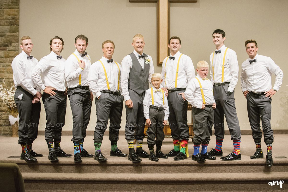 Groomsmen with superhero socks  | Grand Junction Colorado wedding photographer