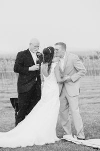 Bride and Groom's first kiss in the rain | amanda.matilda.photography