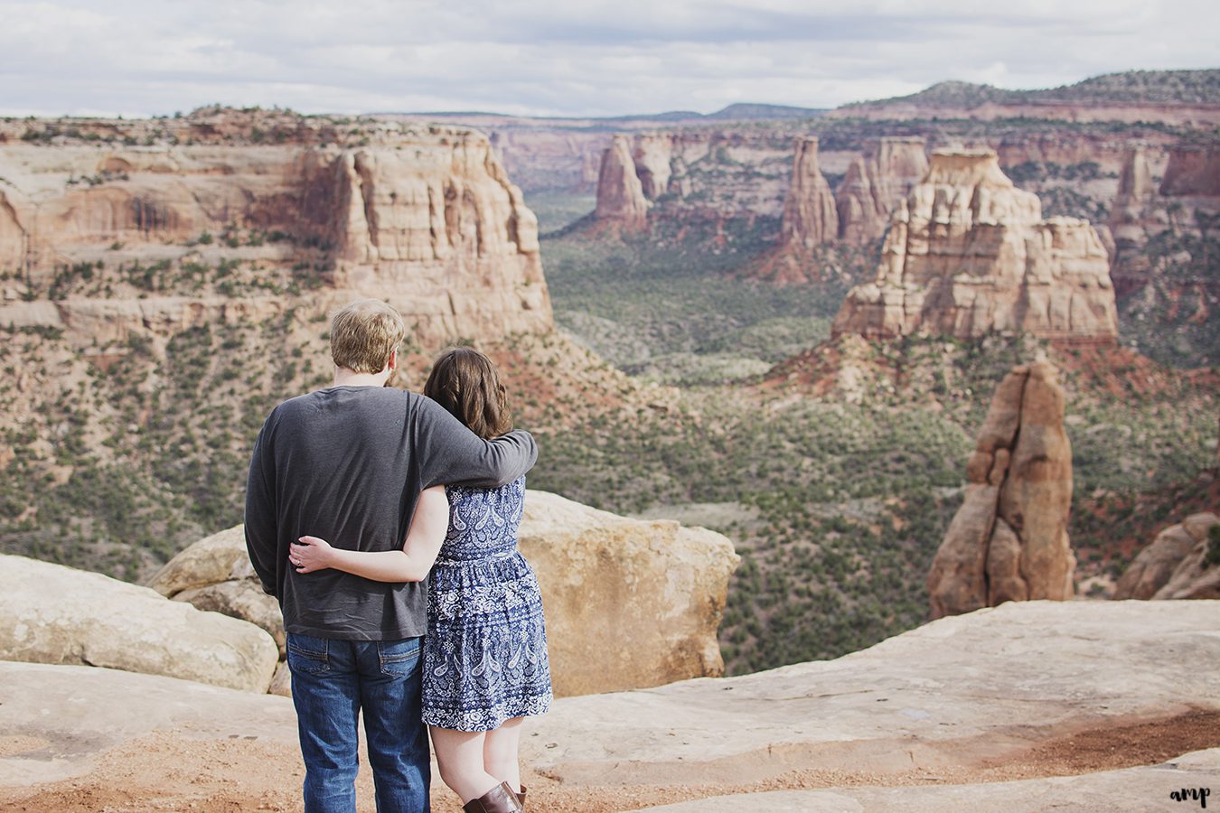 Couple standing overlooking the Colorado National Monument