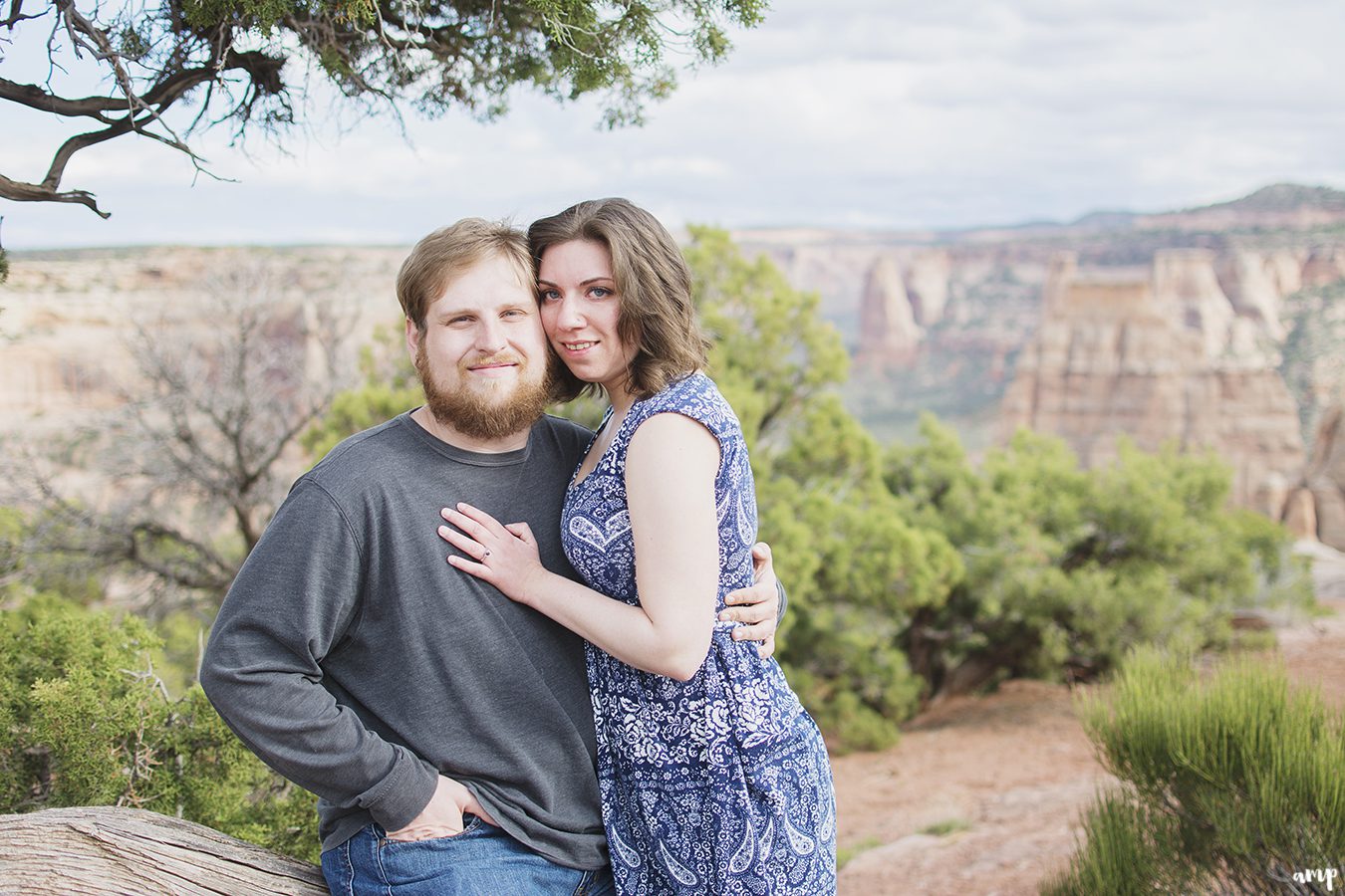 Couple cuddling overlooking the Colorado National Monument