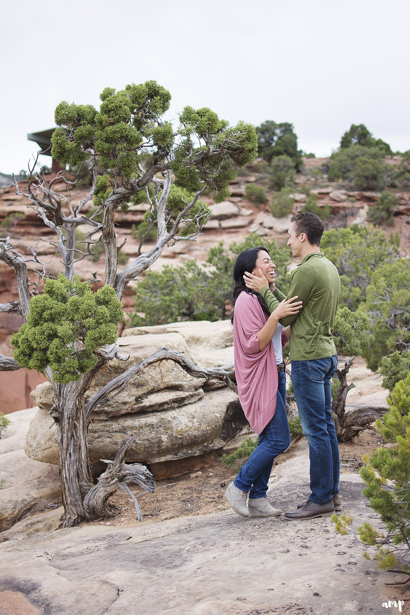 Couple sharing a quiet moment during their desert engagement photos