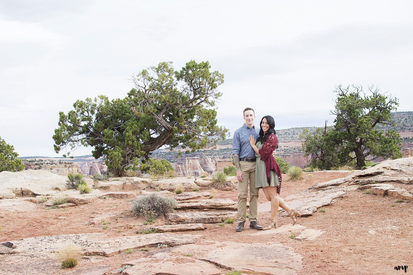 Couple standing in the desert of the Colorado National Monument