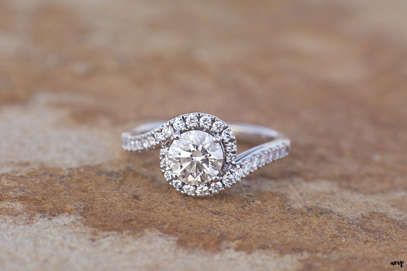 Engagement ring detail shot on red rock