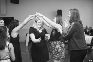 wedding guest doing the limbo on the dance floor