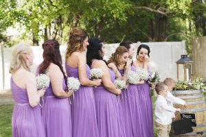 Bridesmaids crying at the wedding ceremony