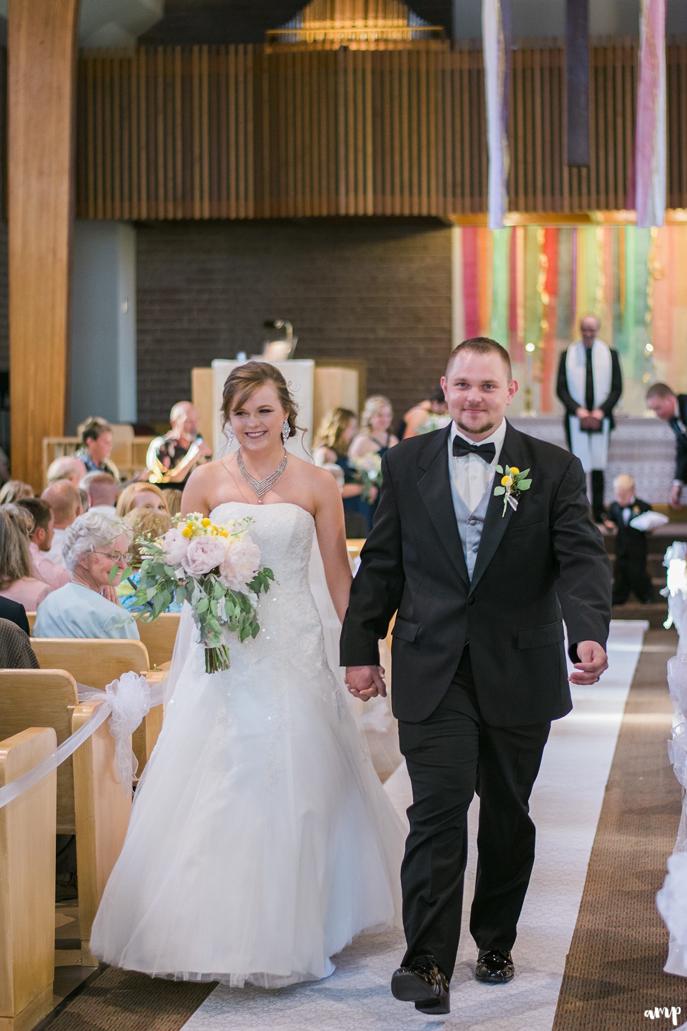 Bride and groom walking out of wedding ceremony