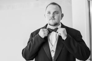 Groom straightening his bow tie | amanda.matilda.photography