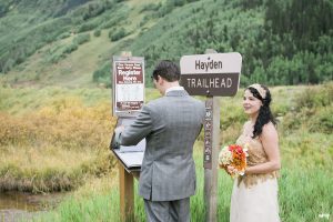 Bride and Groom registering at the Hayden Trailhead for their Ouray elopement