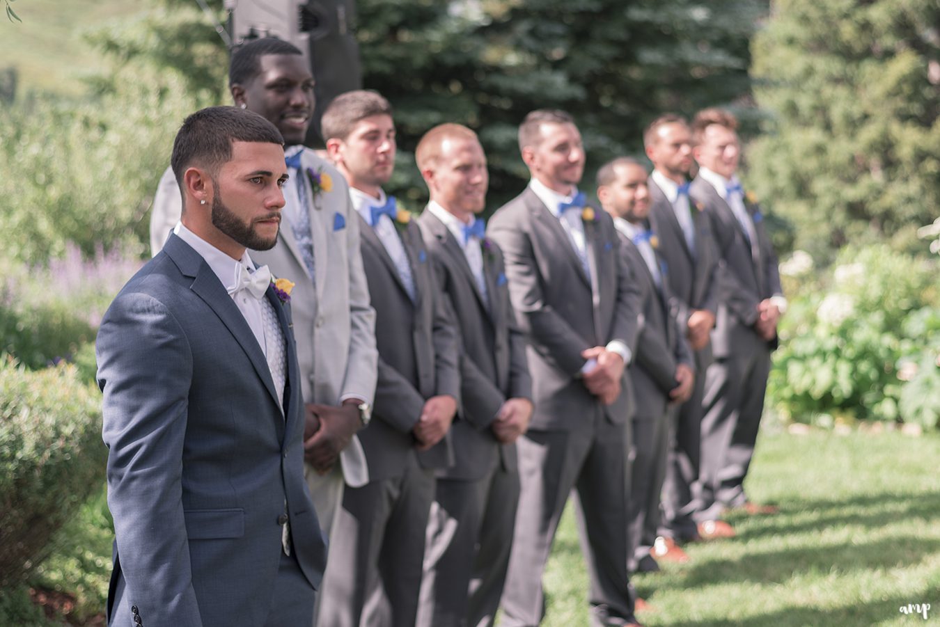 Groom crying as he sees the bride