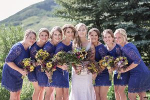 Bridesmaids and their wildflower bouquets in the garden