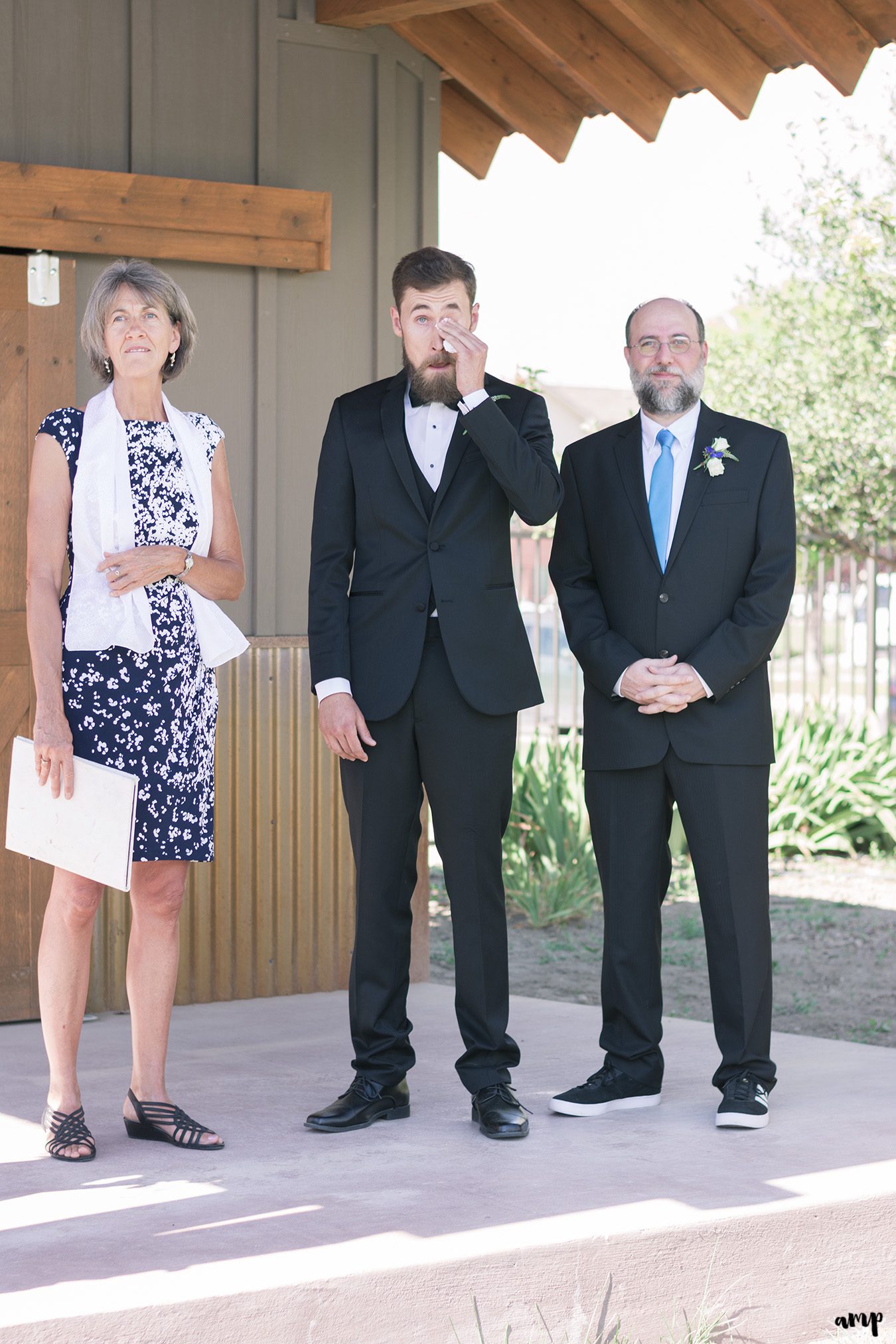 Groom crying seeing his bride walking up the aisle