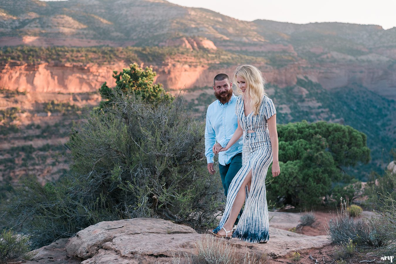 Adventure couple hiking for their engagement session on the Colorado National Monument