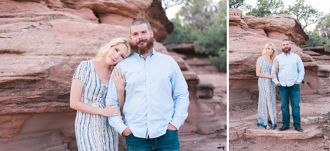 Engaged couple with red rocks of the Monument in the background