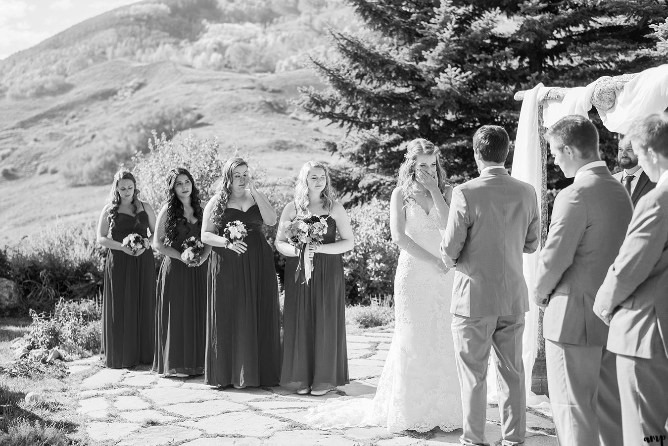 Bride cries during their wedding ceremony at the Mountain Wedding Garden in Crested Butte