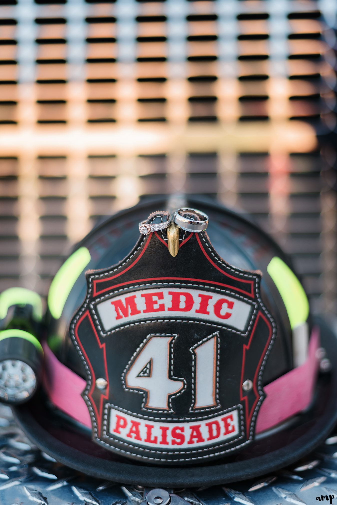 Engagement rings on a firefighter hat