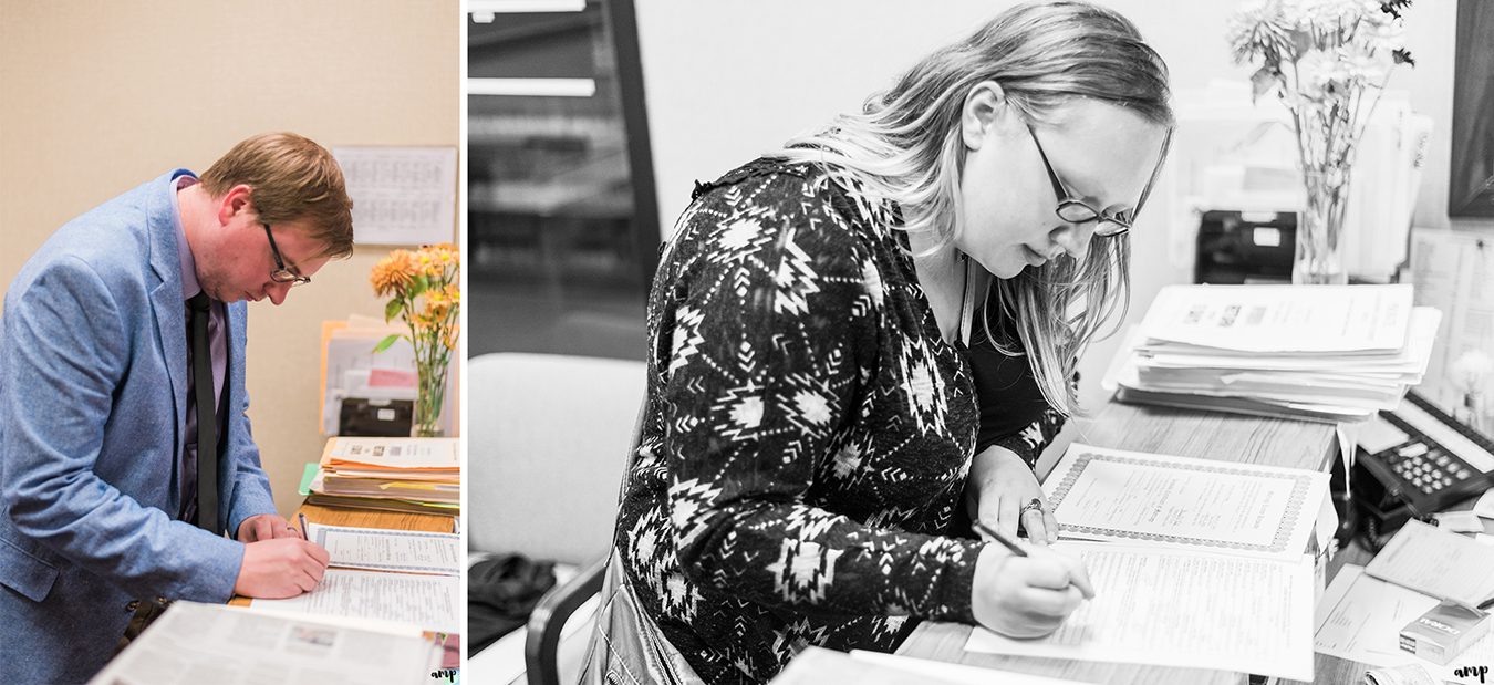 Witnesses signing the papers at the Courthouse Wedding in Omaha | amanda.matilda.photography