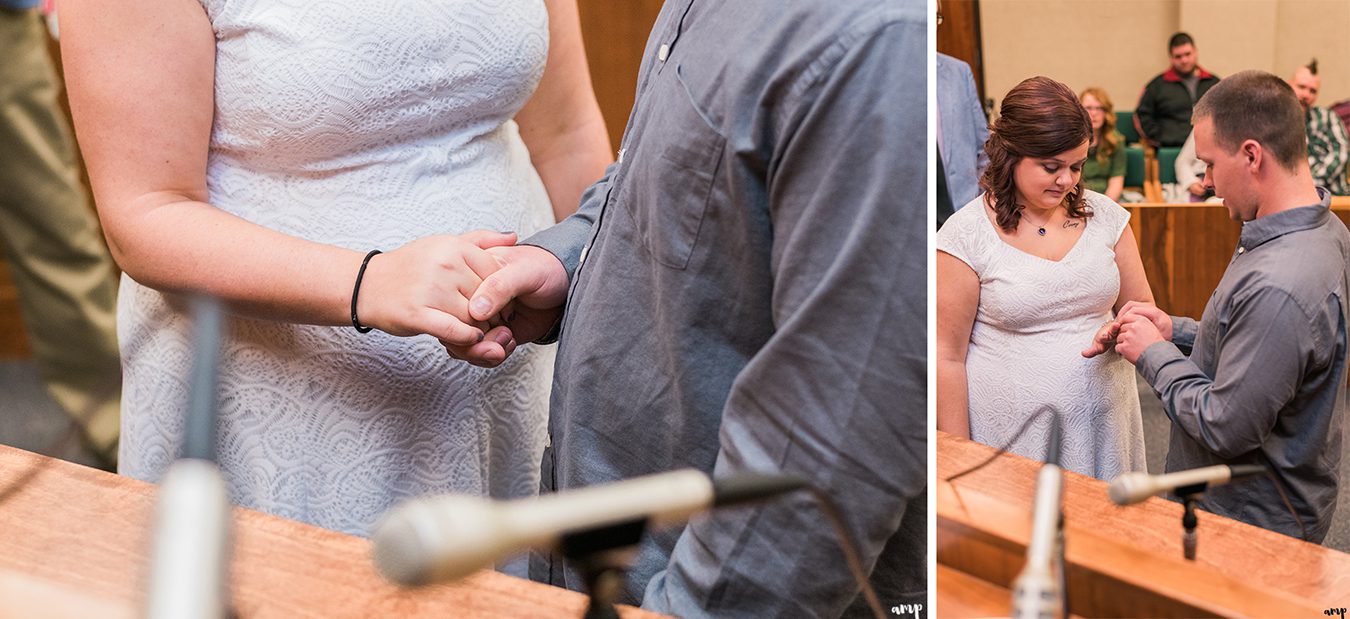Couple exchange rings at their courthouse wedding in omaha