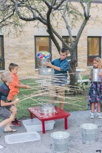 Kids play kerplunk yard games at a Grand Junction Wedding