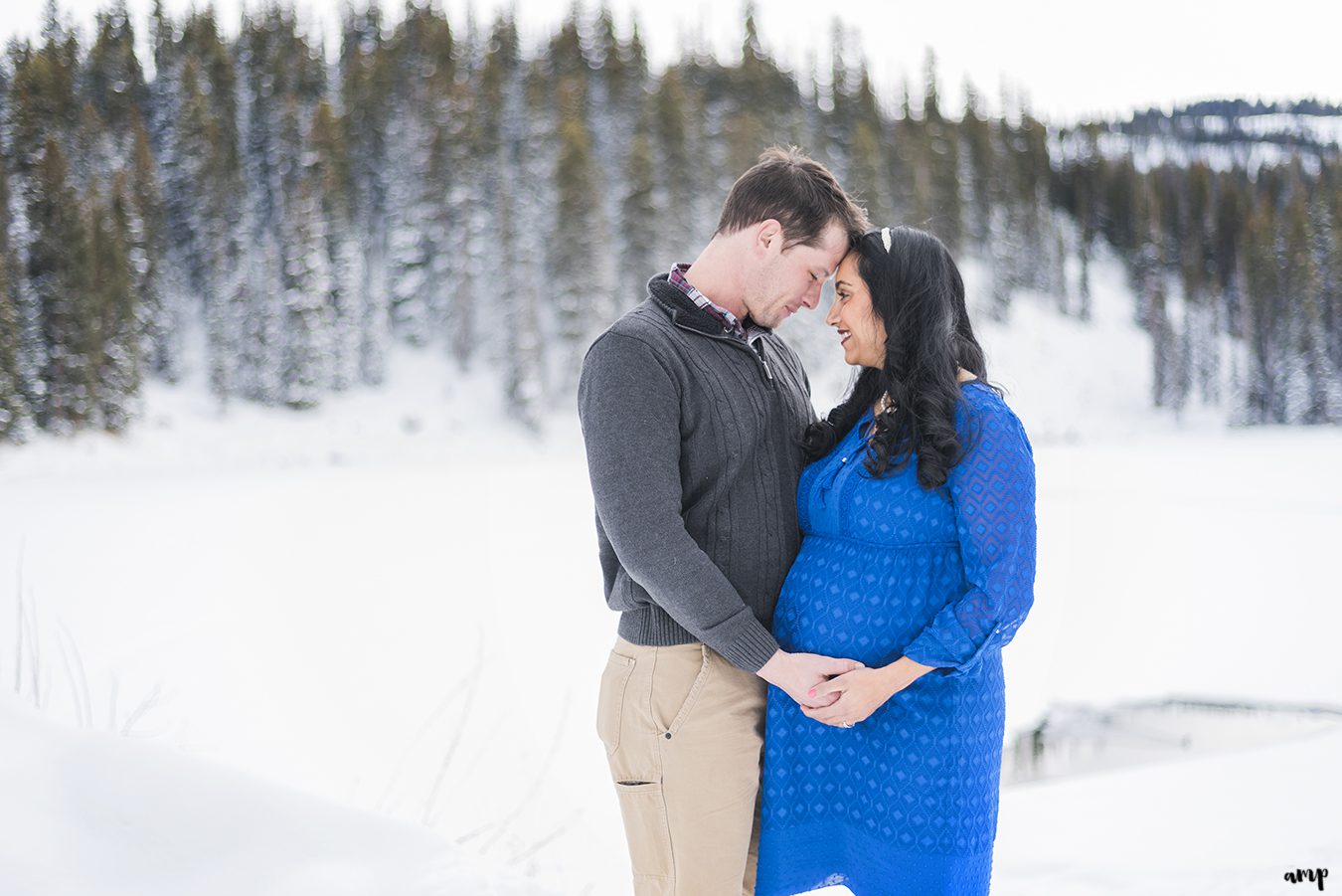 Expecting couple embraces the baby bump on the Grand Mesa