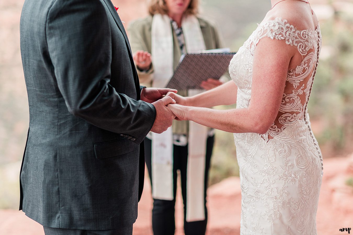 Bride and groom hold hands during their elopement on the Colorado National Monument