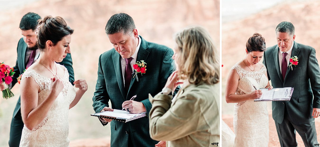 Newlyweds sign the marriage certificate