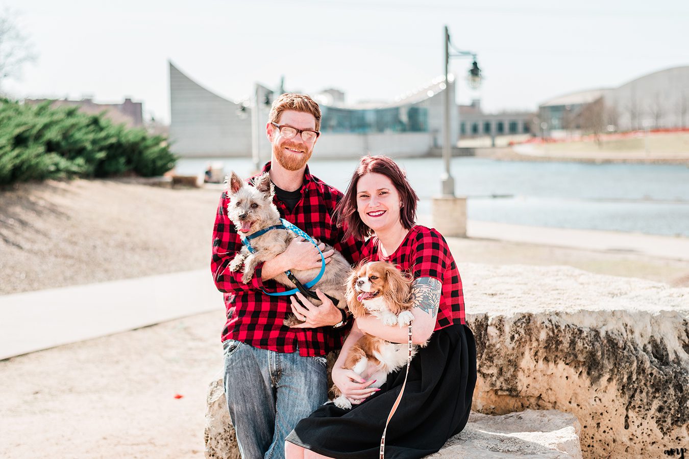 Ben and Courtnee walking their dogs along the riverfront