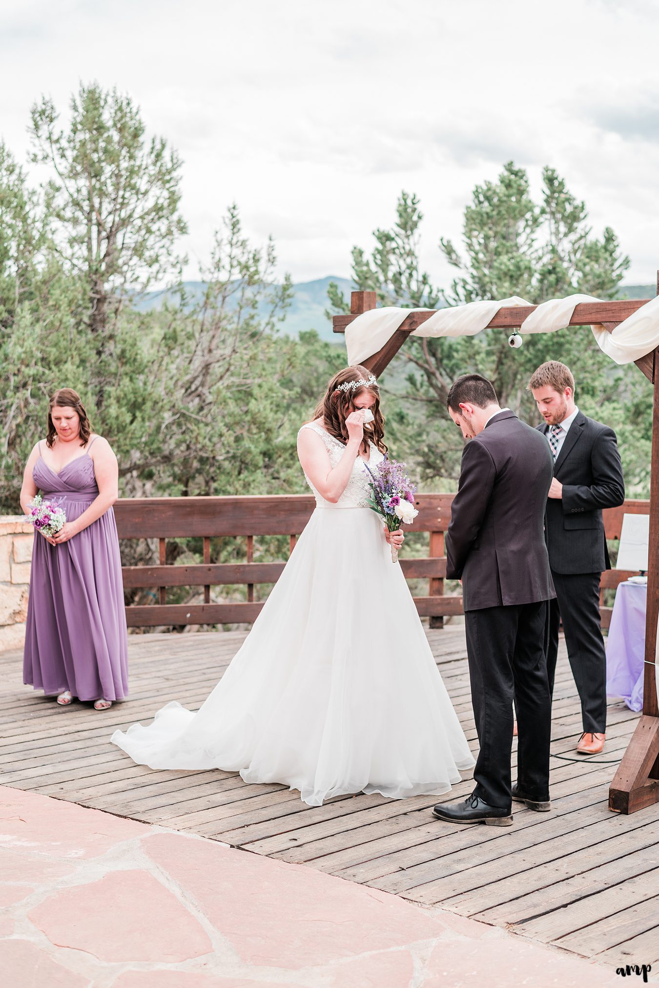 Erica wipes away a tear during their Ridgway State Park elopement ceremony