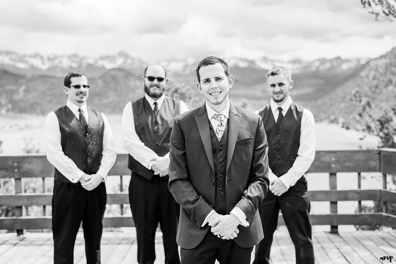 Travis stands with his groomsmen at the Ridgway State Park overlook