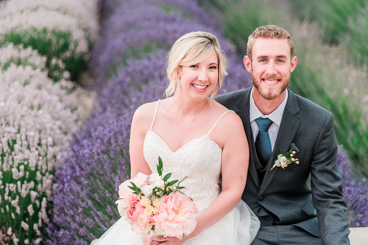 Bride and Groom sitting in a lavender field