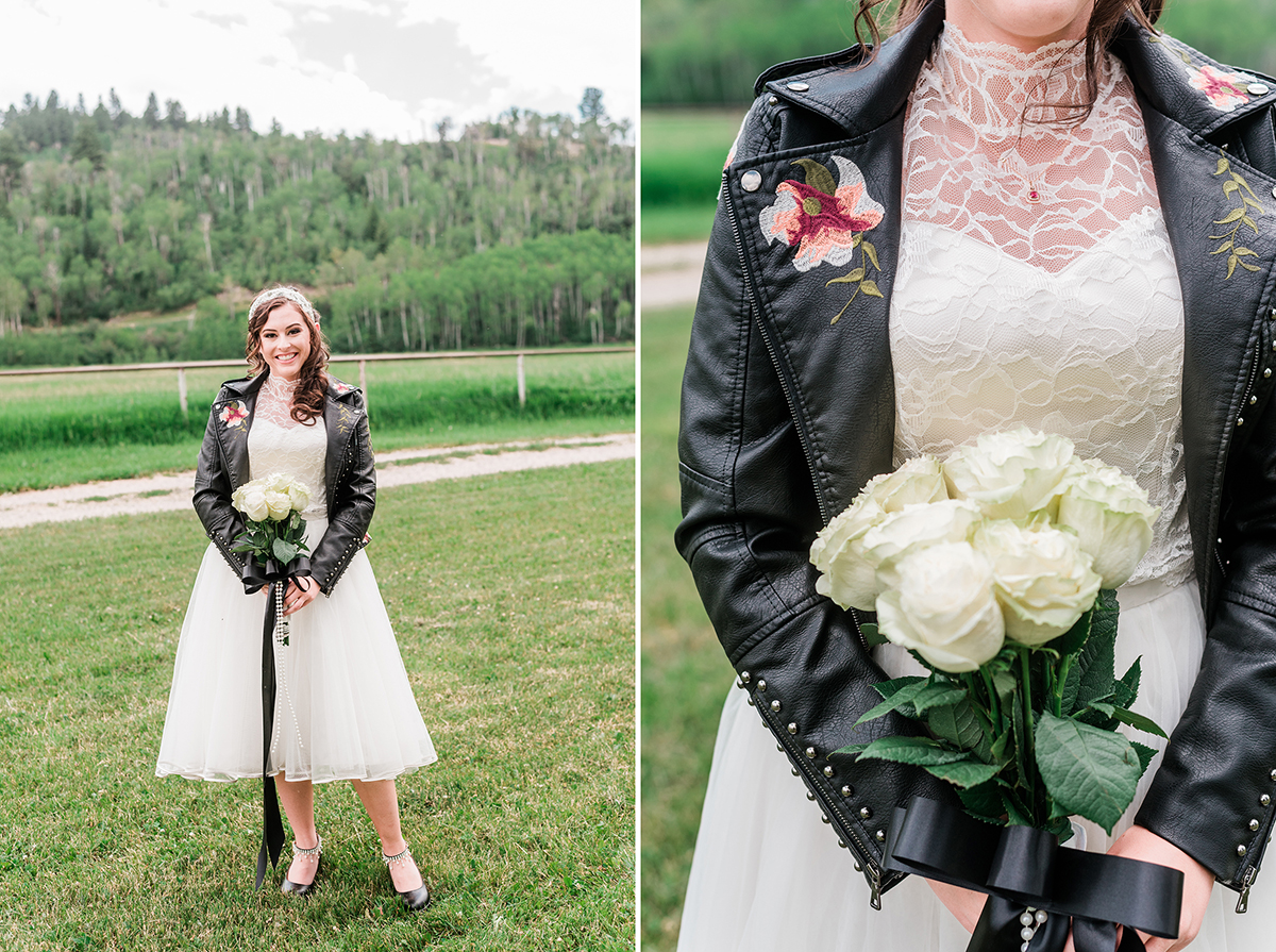 Bride wearing a black leather jacket with her two piece wedding dress