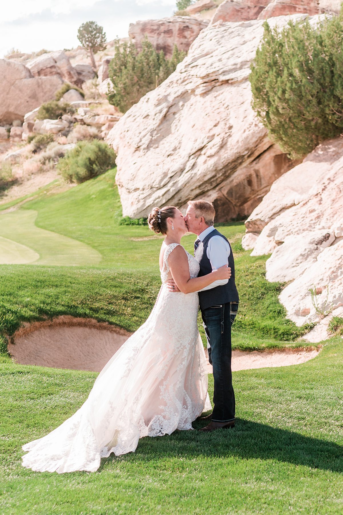 Bob & Jamie near a sand trap on the Redlands Mesa golf course