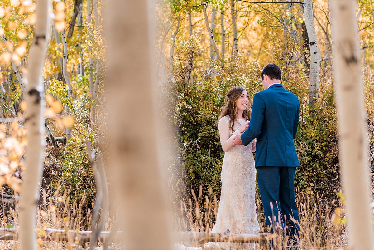 Couple exchanging private vows at Woods Walk in Crested Butte