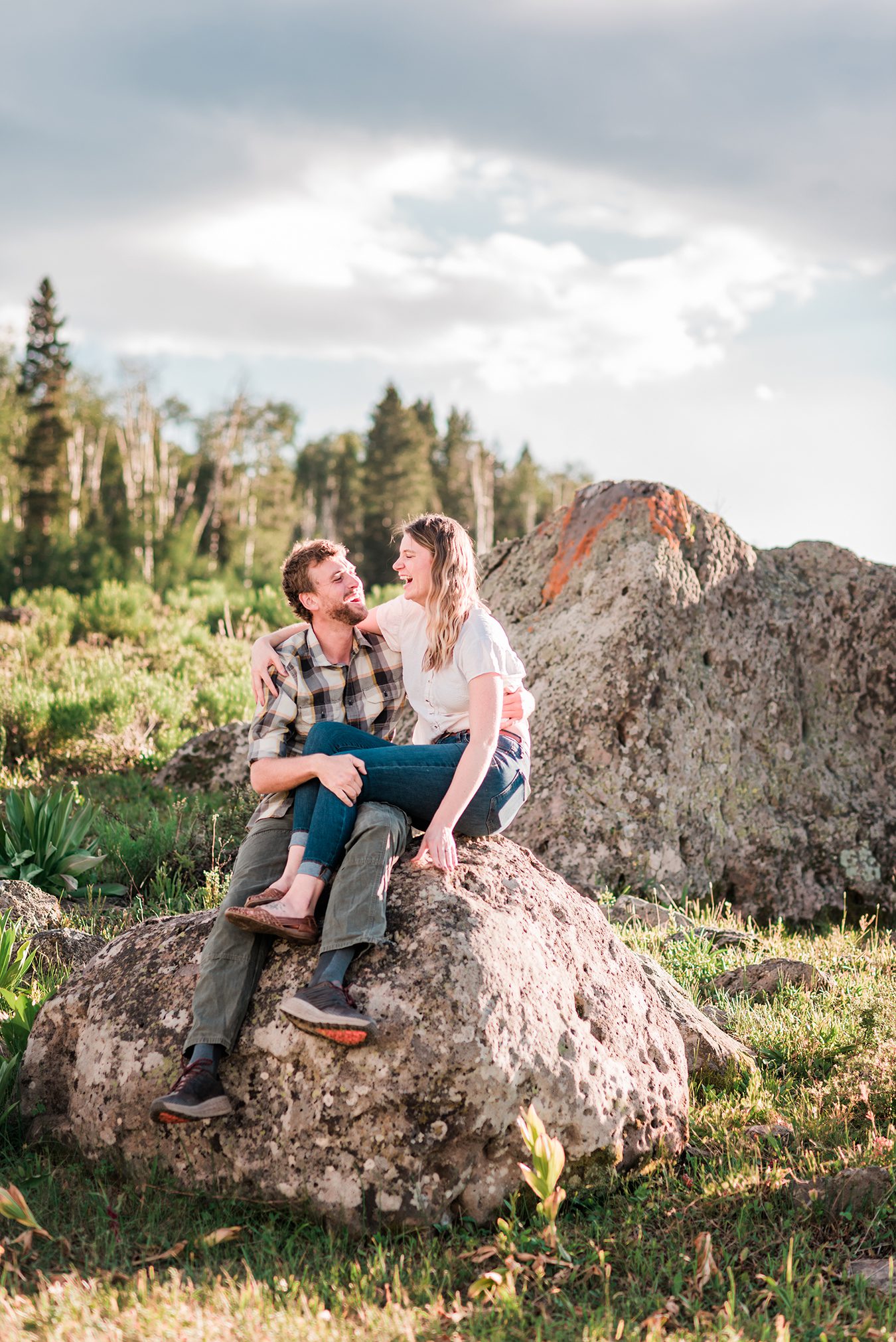 Annie & Taylor sitting on a boulder for their Glenwood Springs Engagement Photos