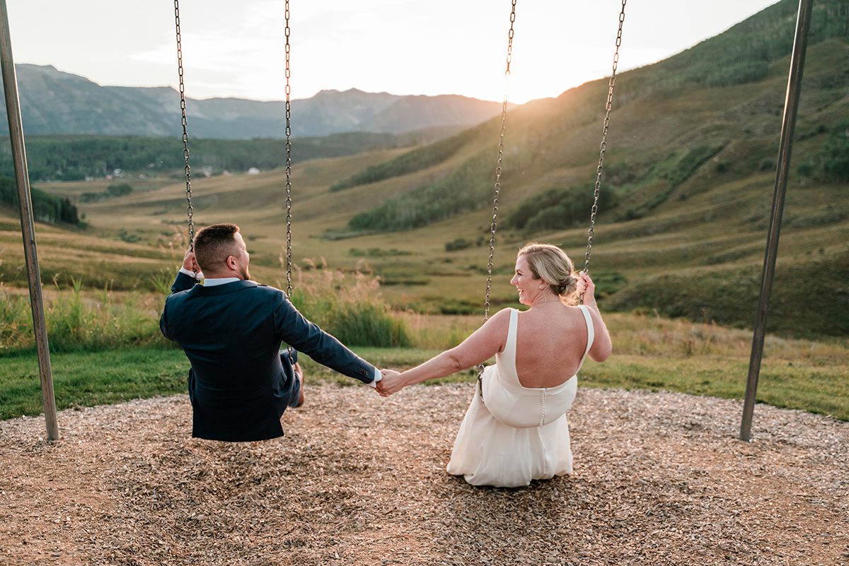 Sarah & Andy photo on the swings at Mountain Wedding Garden