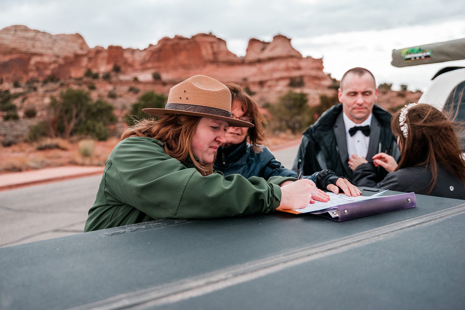 Canyonlands Moab Elopement - Park Ranger signs marriage certificate